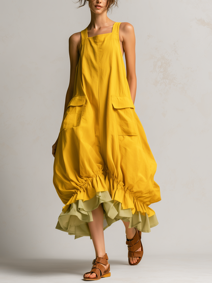 Amparo | Vestido midi tipo overall amarillo sin mangas con bolsillos cargo y dobladillo de volantes en capas