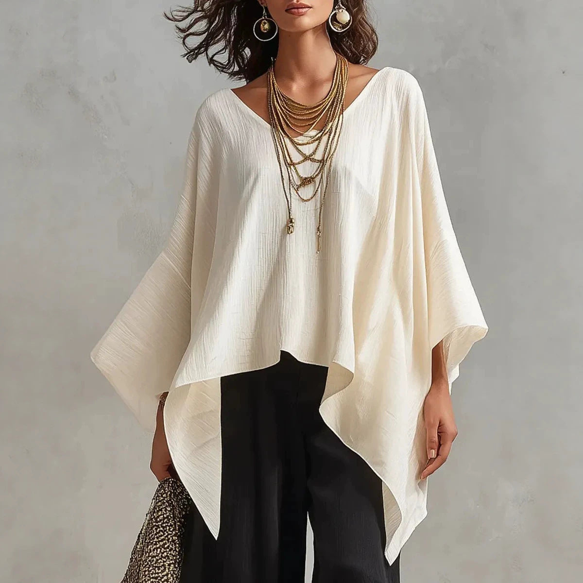 Top da donna in cotone-lino con scollo a V, maniche 3/4, taglio ampio e informale