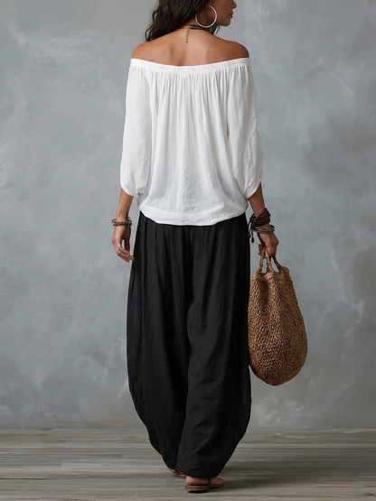 Manuela | Completo con top bianco a spalle scoperte e pantaloni larghi a lanterna
