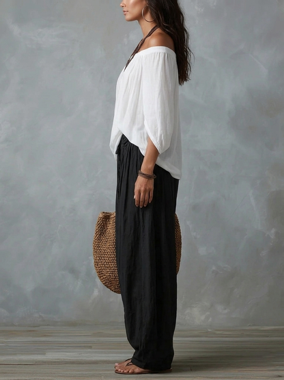 Manuela | Completo con top bianco a spalle scoperte e pantaloni larghi a lanterna