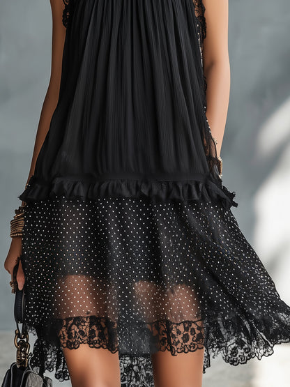 Vestito corto nero a pois trasparente con bordo in pizzo e balze