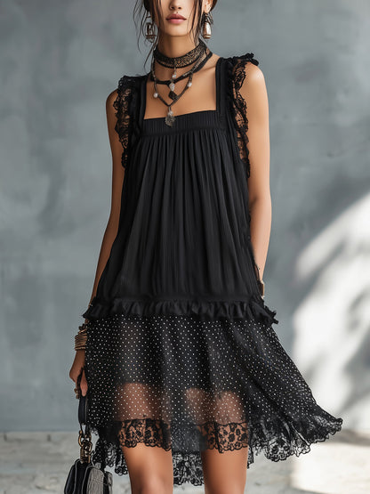 Vestito corto nero a pois trasparente con bordo in pizzo e balze