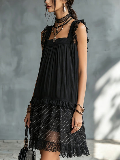 Vestito corto nero a pois trasparente con bordo in pizzo e balze