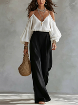 Andrea | Conjunto con top blanco de hombros descubiertos y pantalones negros palazzo