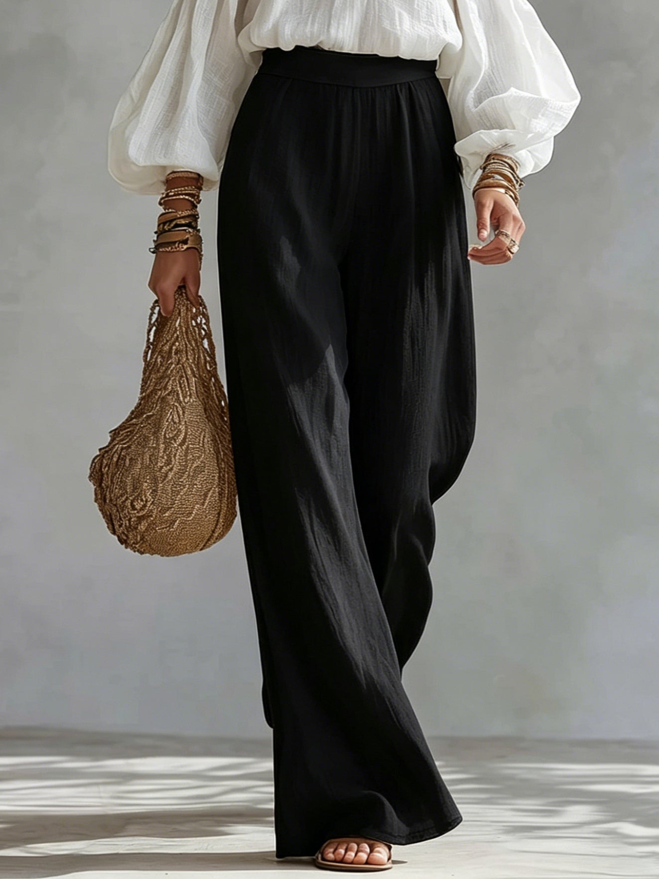 Andrea | Conjunto con top blanco de hombros descubiertos y pantalones negros palazzo