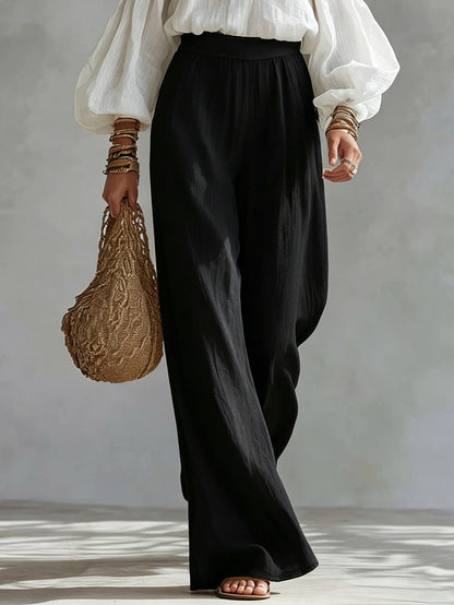 Nicoletta | Completo con top bianco a spalle scoperte e pantaloni neri a palazzo